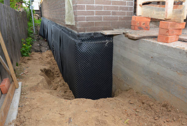 Happy homeowners after waterproofing job in Fort Belvoir